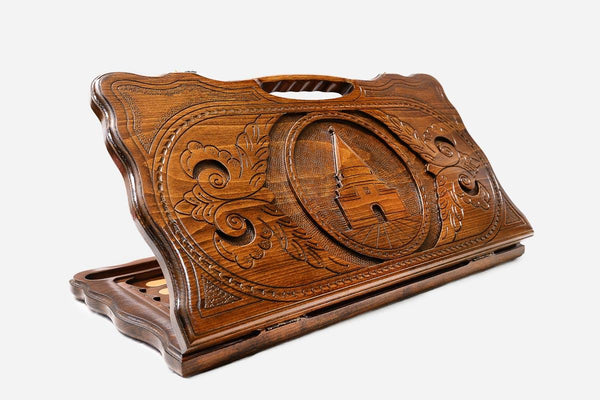 Carved beechwood backgammon board with the Temple of Lalish in a central medallion and a carry handle, propped open