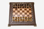 Carved chess set shown folded with carry handle