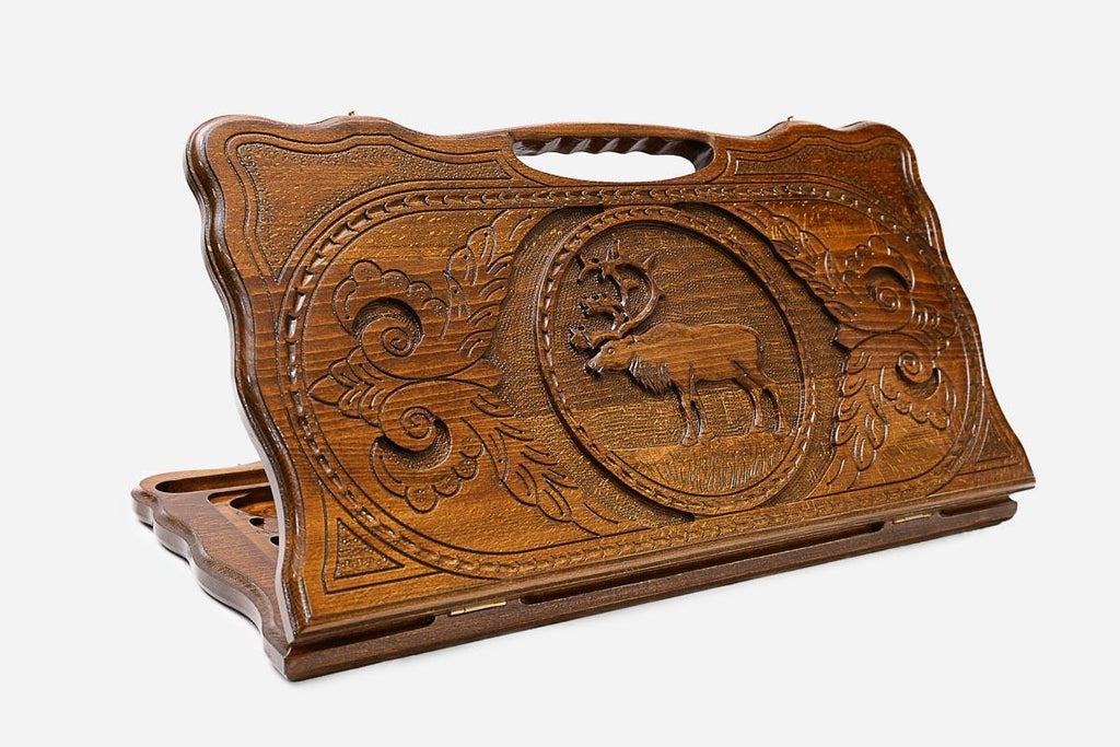 Carved beechwood backgammon board with a stag medallion and a carry handle, propped open