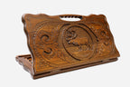Carved beechwood backgammon board with a stag medallion and a carry handle, propped open
