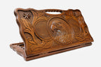 Carved beechwood backgammon board with an eagle medallion and stars, with a carry handle, propped open