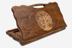 Carved beechwood backgammon board with a tree of life medallion and a carry handle, propped open