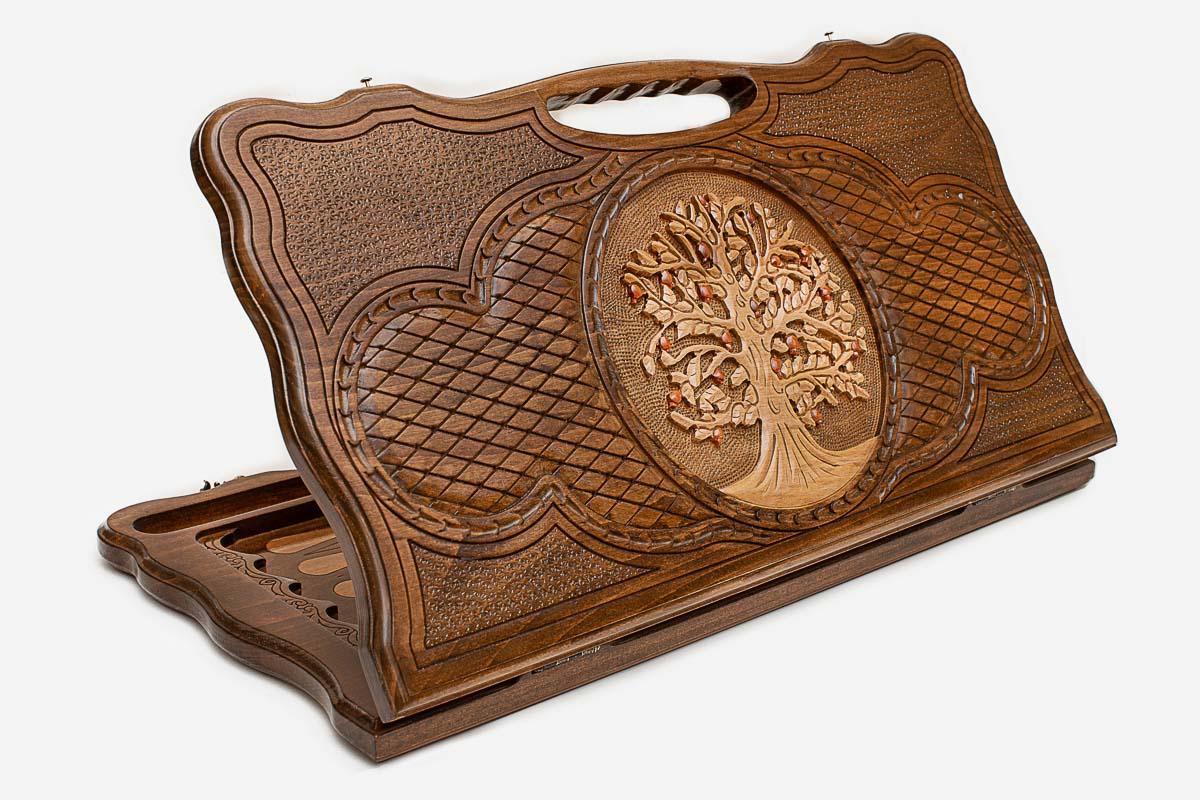 Carved beechwood backgammon board with a tree of life medallion and a carry handle, propped open