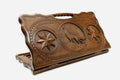 Carved beechwood backgammon board with a wolf medallion and stars, with a carry handle, propped open