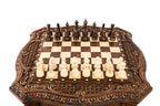 Wooden chess table set up with hand-carved chess pieces
