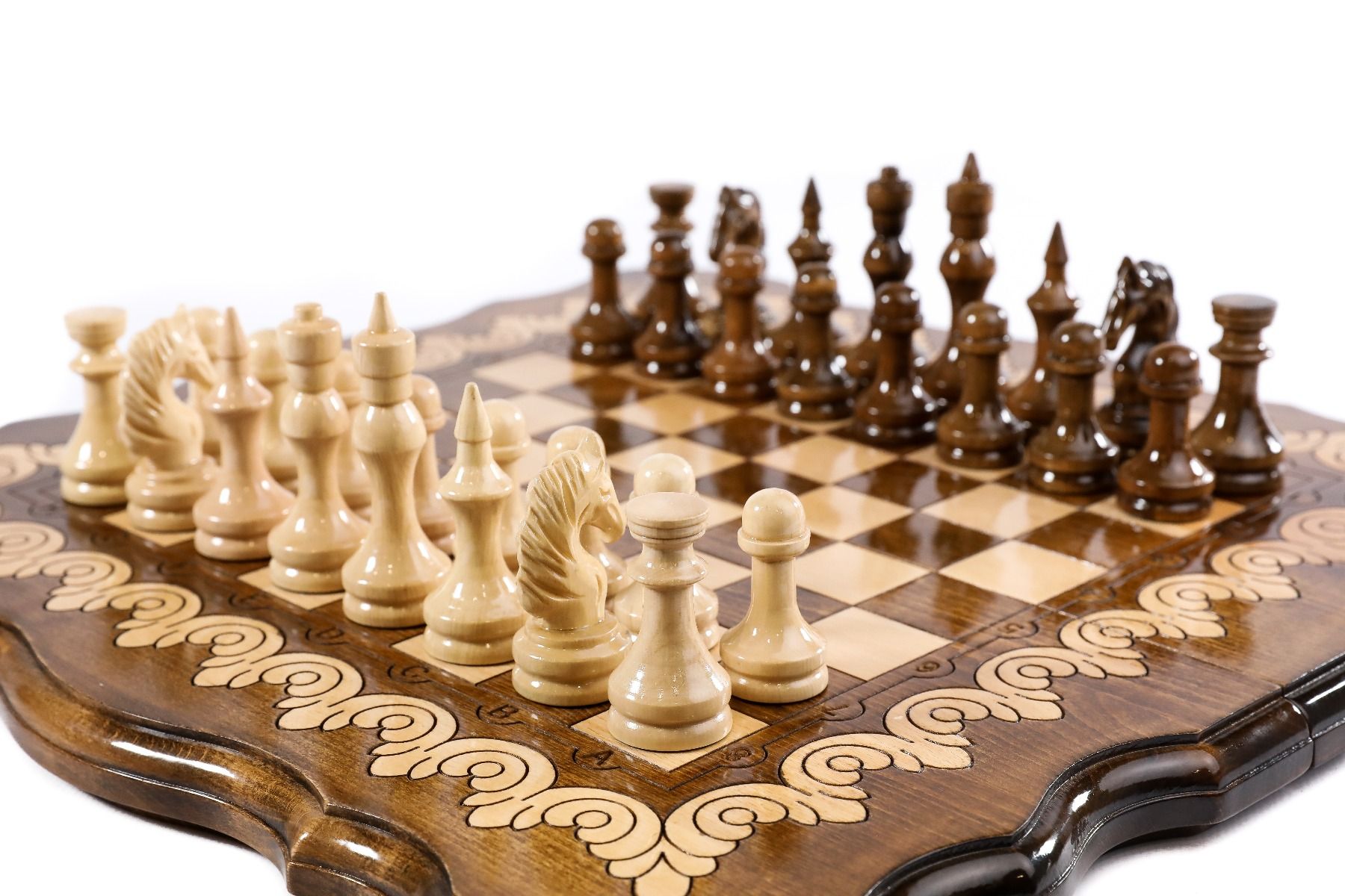 Wooden chess board featuring carved contour detailing and fine craftsmanship