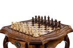 Wooden chess table set up with hand-carved chess pieces