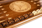 Mercedes Benz backgammon board - playing pieces and dice arranged on the board