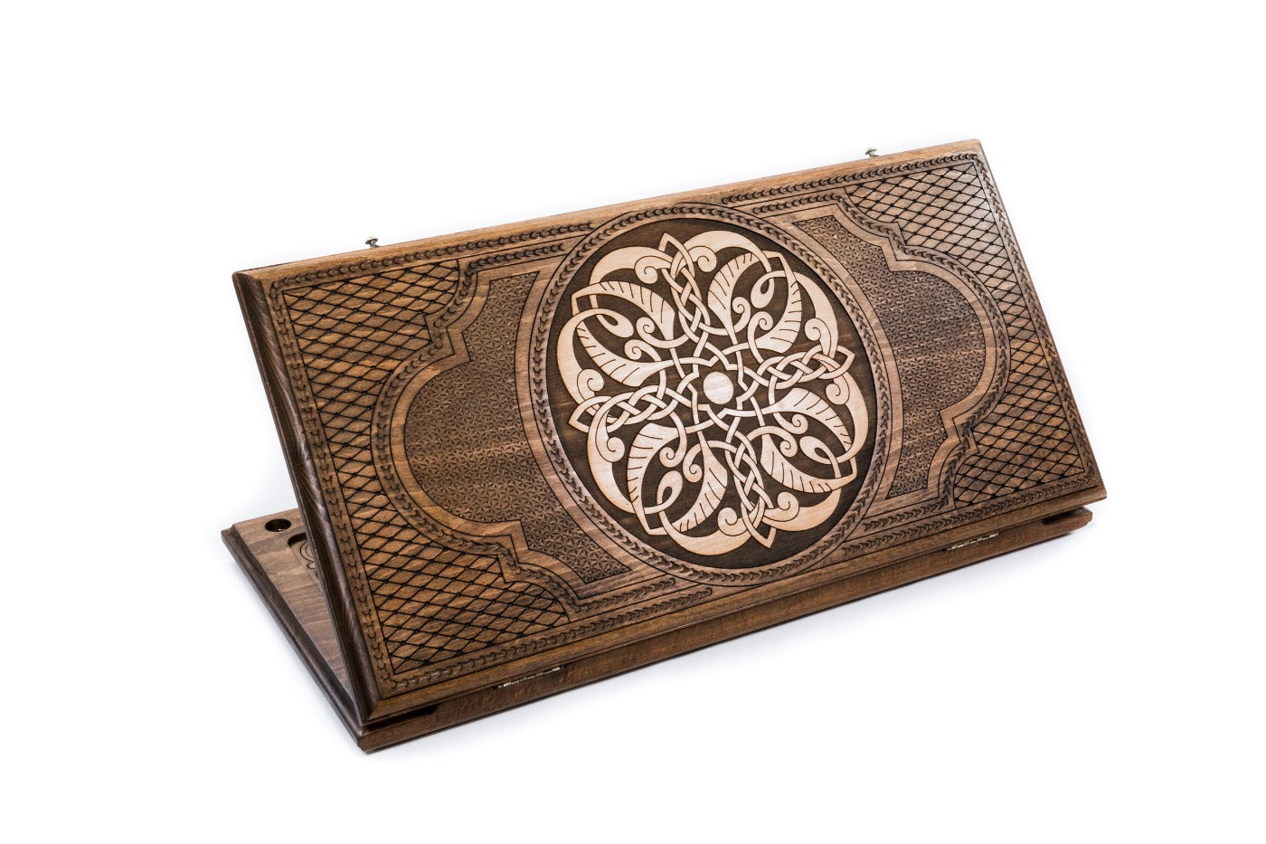 A frontal shot of the closed Ornamental Braid classic backgammon board showing the continuous hand-carved interlaced relief.