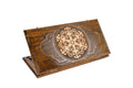 A frontal shot of the closed Ornamental Snowflake backgammon board showing the symmetrical hand-carved relief in solid wood.