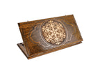 A frontal shot of the closed Ornamental Snowflake backgammon board showing the symmetrical hand-carved relief in solid wood.