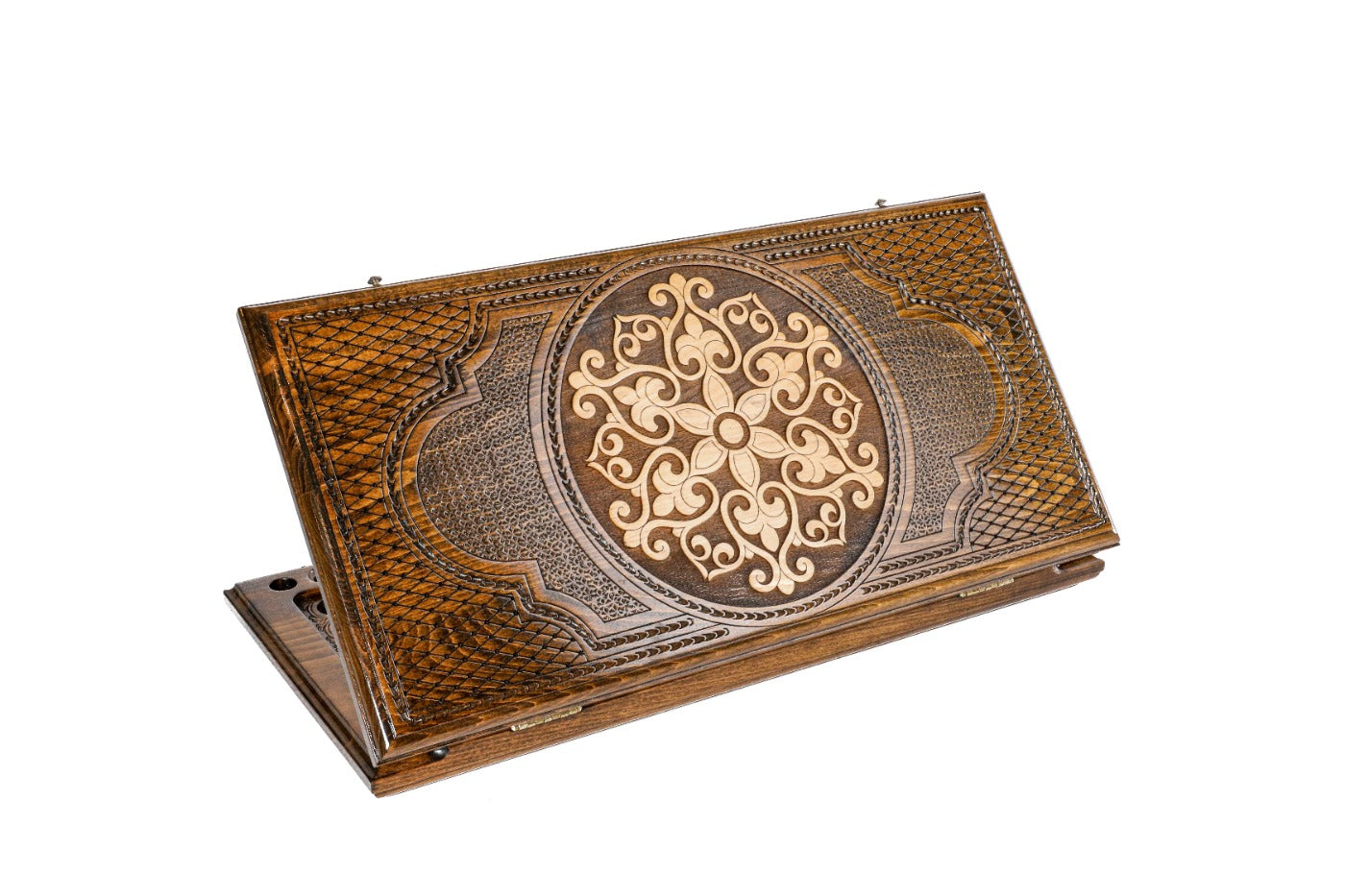A frontal shot of the closed Ornamental Snowflake backgammon board showing the symmetrical hand-carved relief in solid wood.