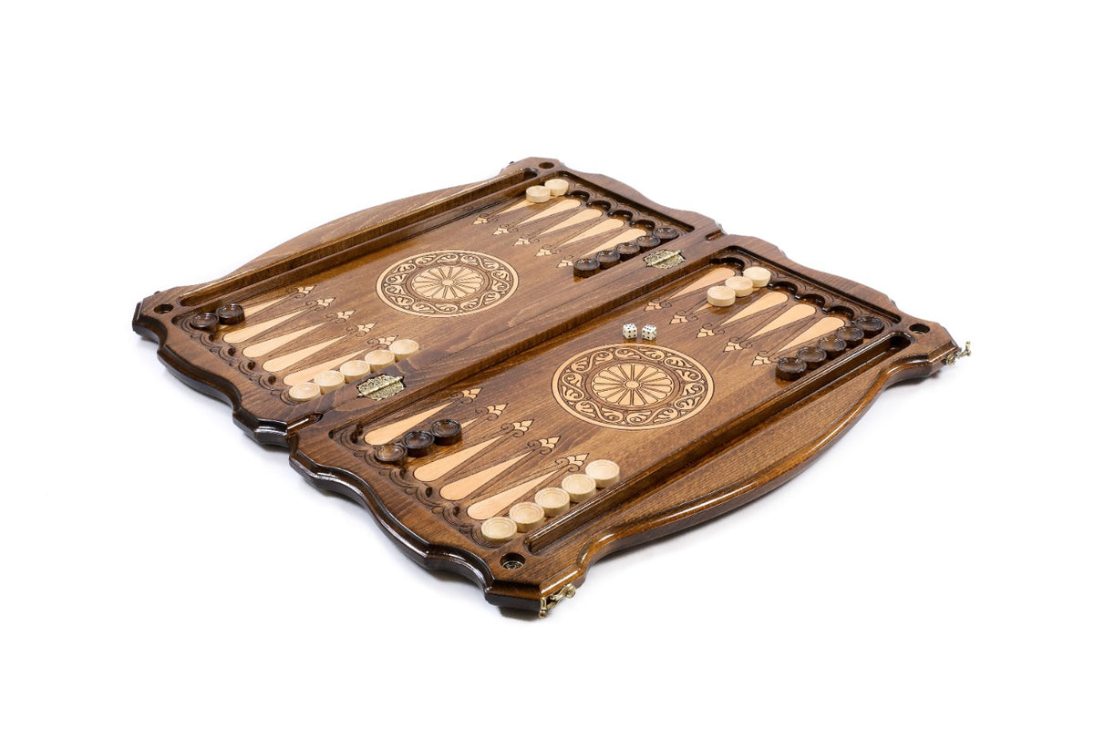 Backgammon set open with pale and dark checkers and dice on the 60 cm board, angled view