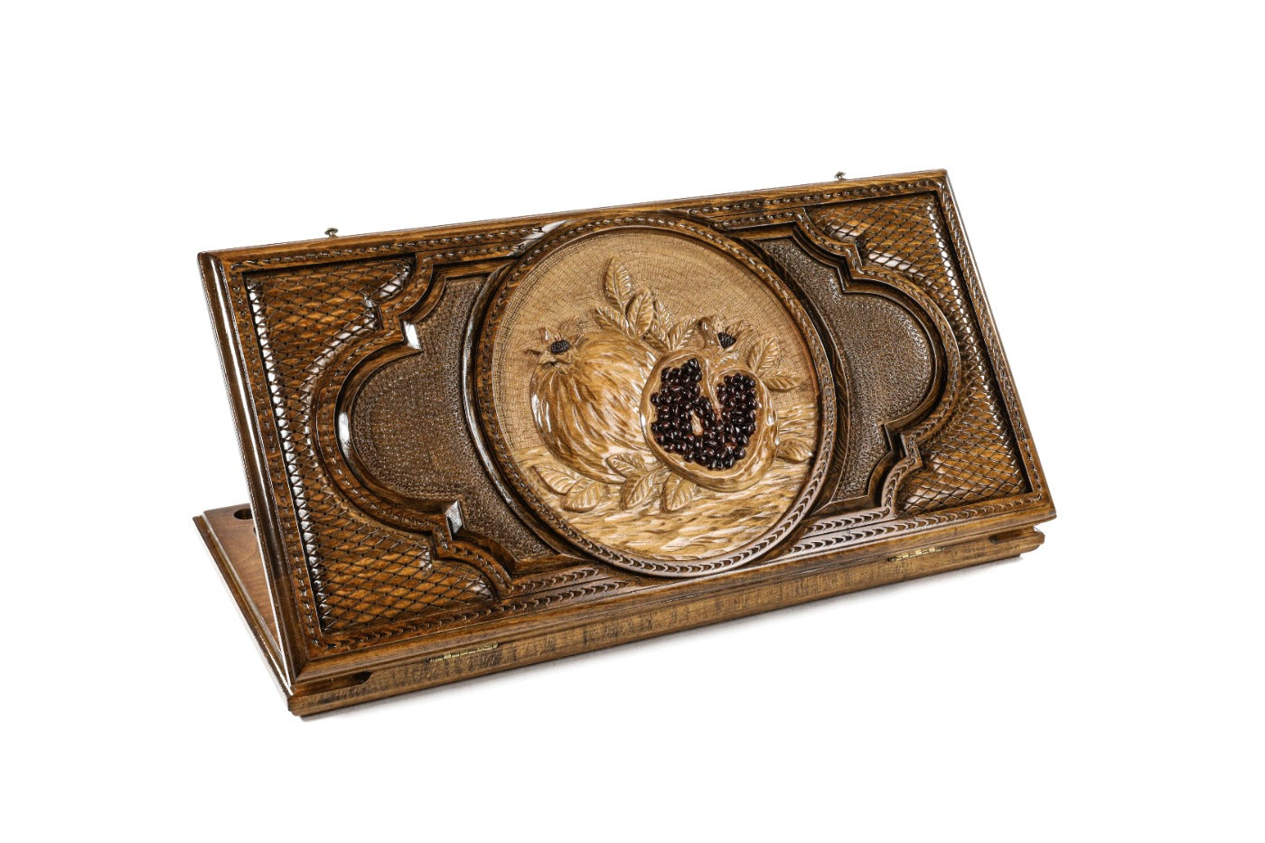 Closed Pomegranate Heritage backgammon board showing the detailed hand-carved fruit and vine motif.