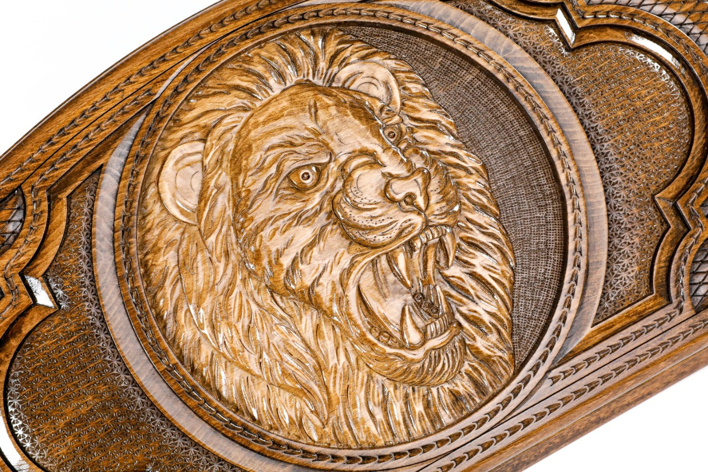 The interior view of the Hrachya Ohanyan lion backgammon set showing the polished wood and contrasting playing pips.