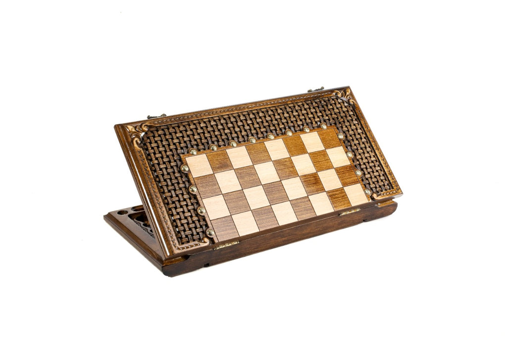 Closed chess board standing on edge, carved braid frame with bronze studs and scroll corners