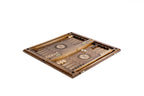 Chess and backgammon set opened to the carved backgammon field with wheel ornaments and checkers