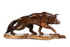 Hand-carved wolf sculpture — reverse side view