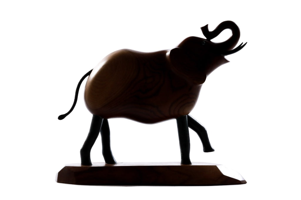 Hand-carved elephant sculpture, reverse side view