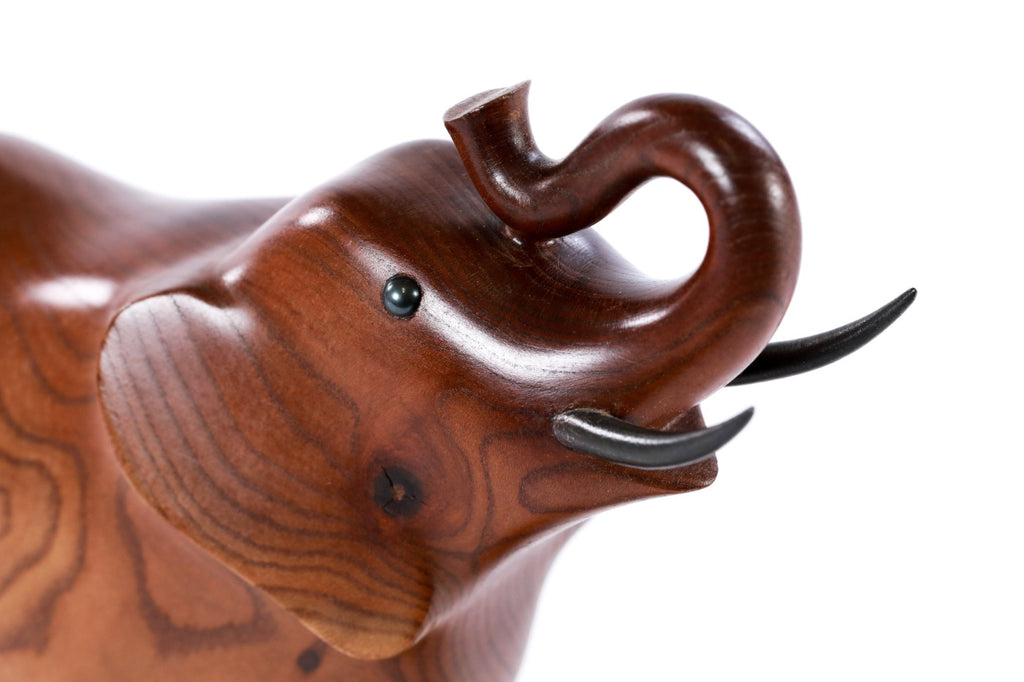 Elephant sculpture in carved apricot wood — side view