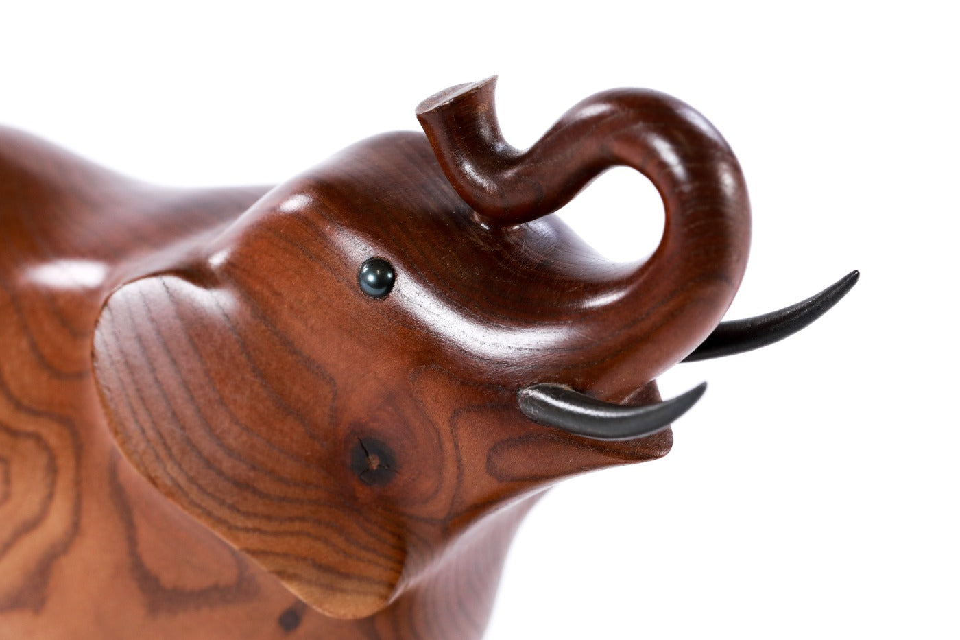 Elephant sculpture in carved apricot wood — side view