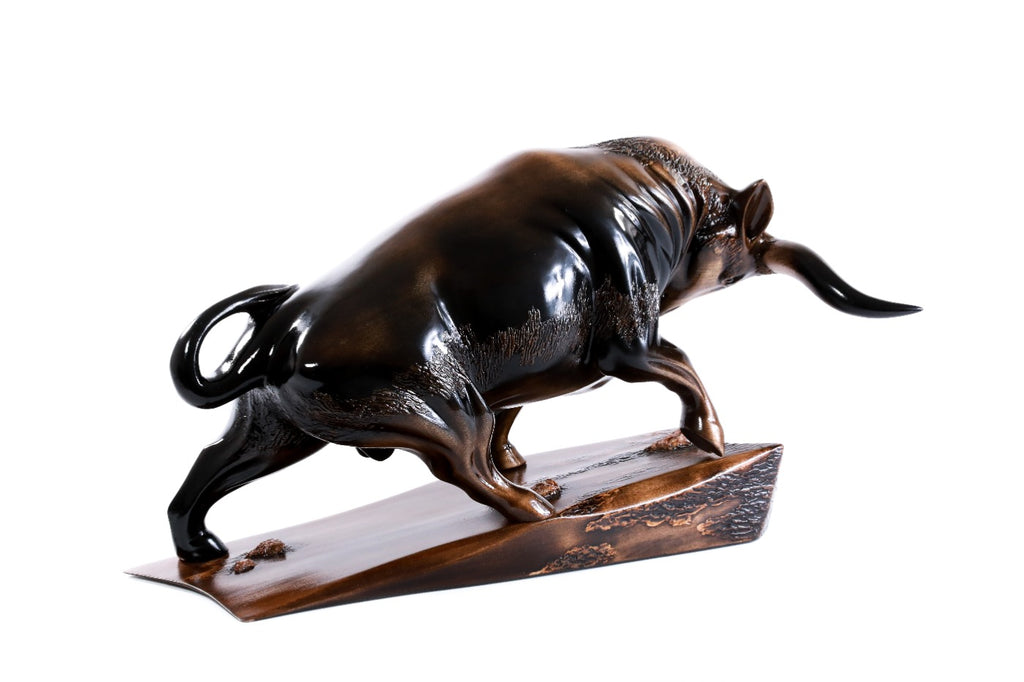 Hand-carved bull sculpture — back view