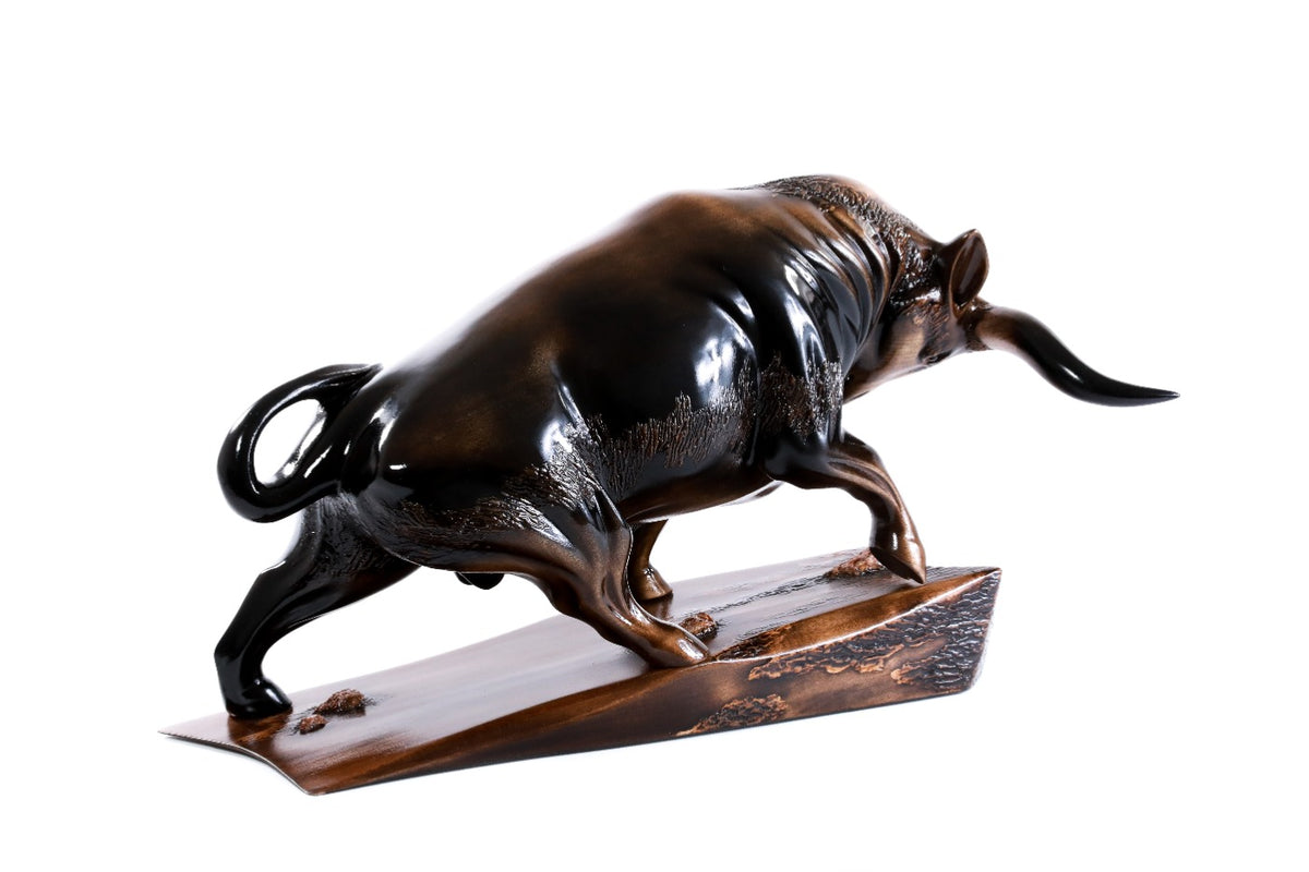 Hand-carved bull sculpture — back view