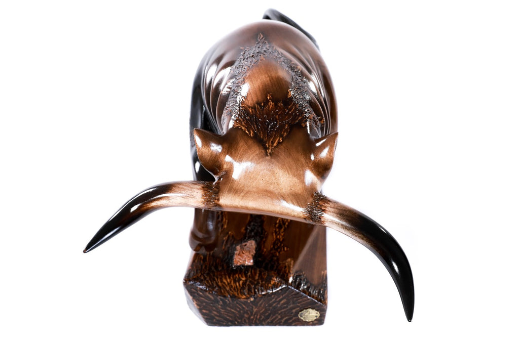 Wooden sculpture of a bull — close-up