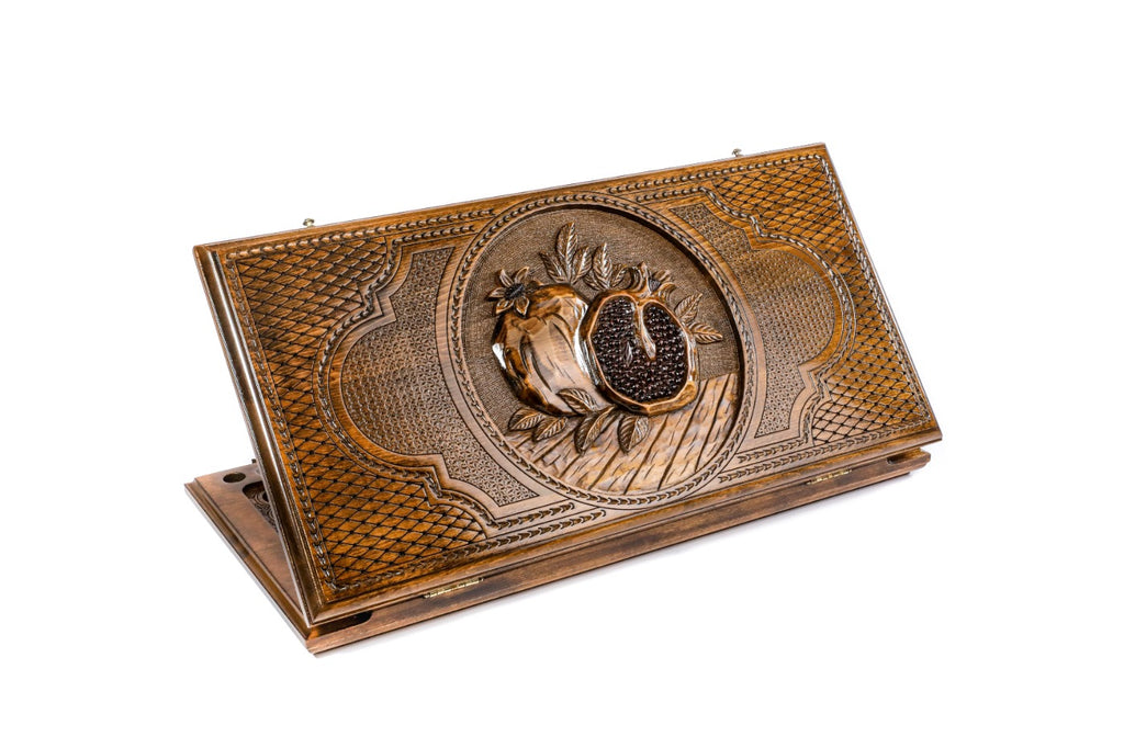 Closed Pomegranate backgammon board with intricate 3D hand-carved fruit motifs.