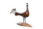 Wooden peacock sculpture hand carved with metal pieces — detail view