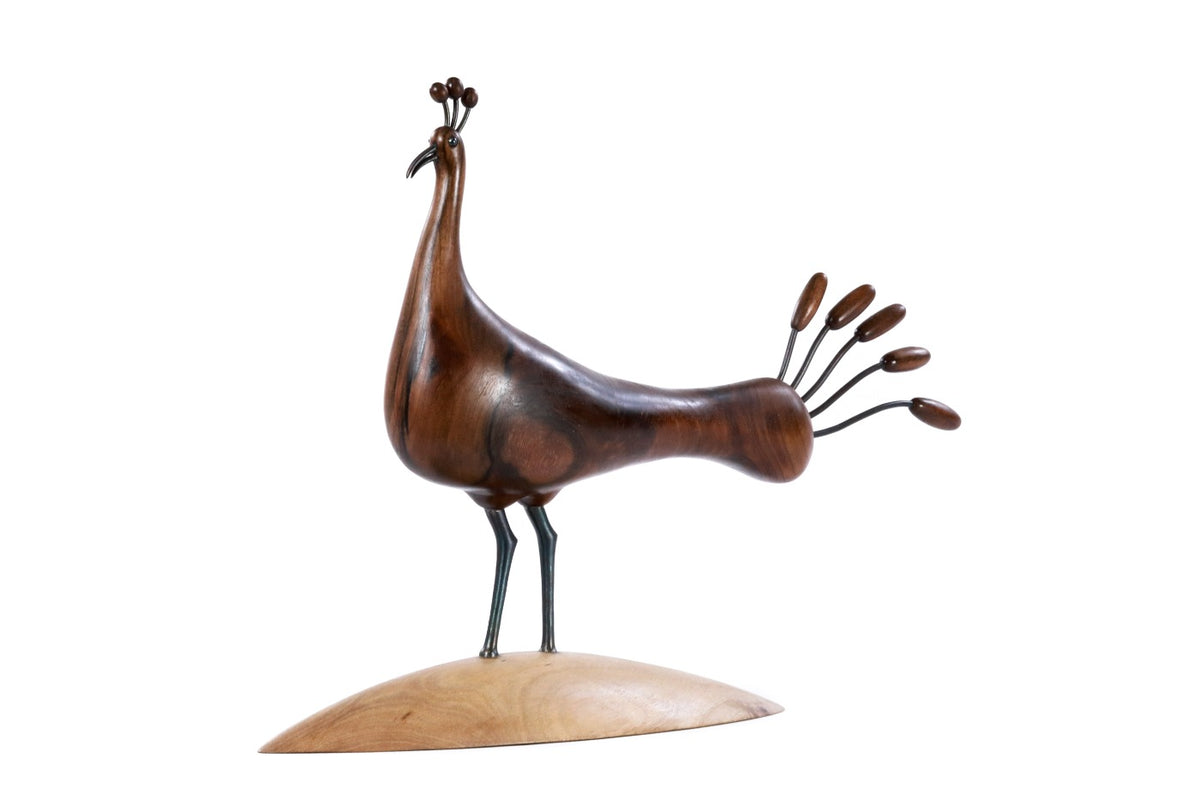 Handmade wooden peacock sculpture — carving detail