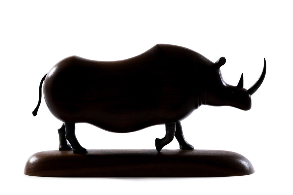 Hand-carved walnut rhinoceros sculpture, 11" / 28 cm — full view