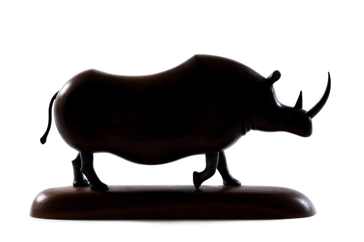 Hand-carved walnut rhinoceros sculpture, 11" / 28 cm — full view
