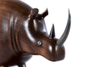 Rhinoceros sculpture in carved walnut wood — side view