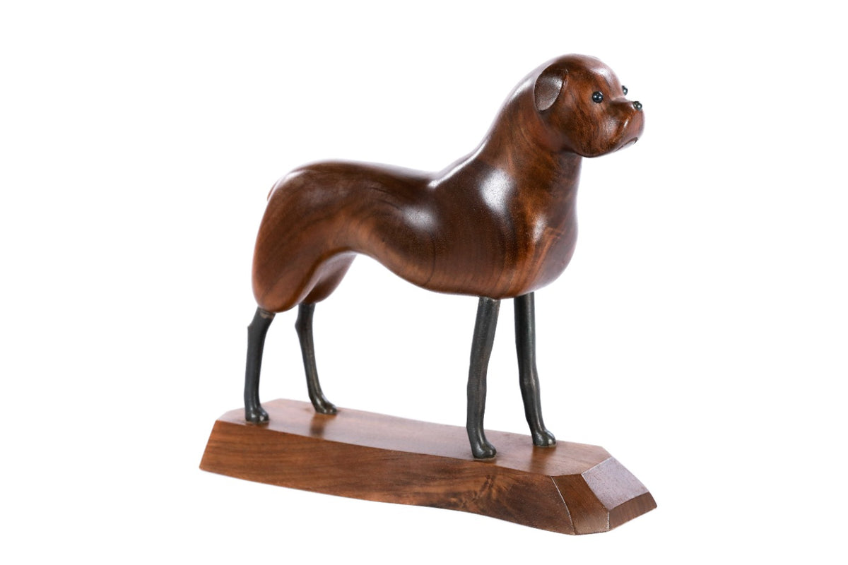 Walnut dog sculpture hand carved with metal pieces — detail view