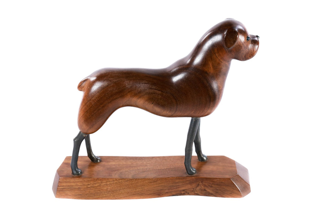 Hand-carved dog sculpture, reverse side view