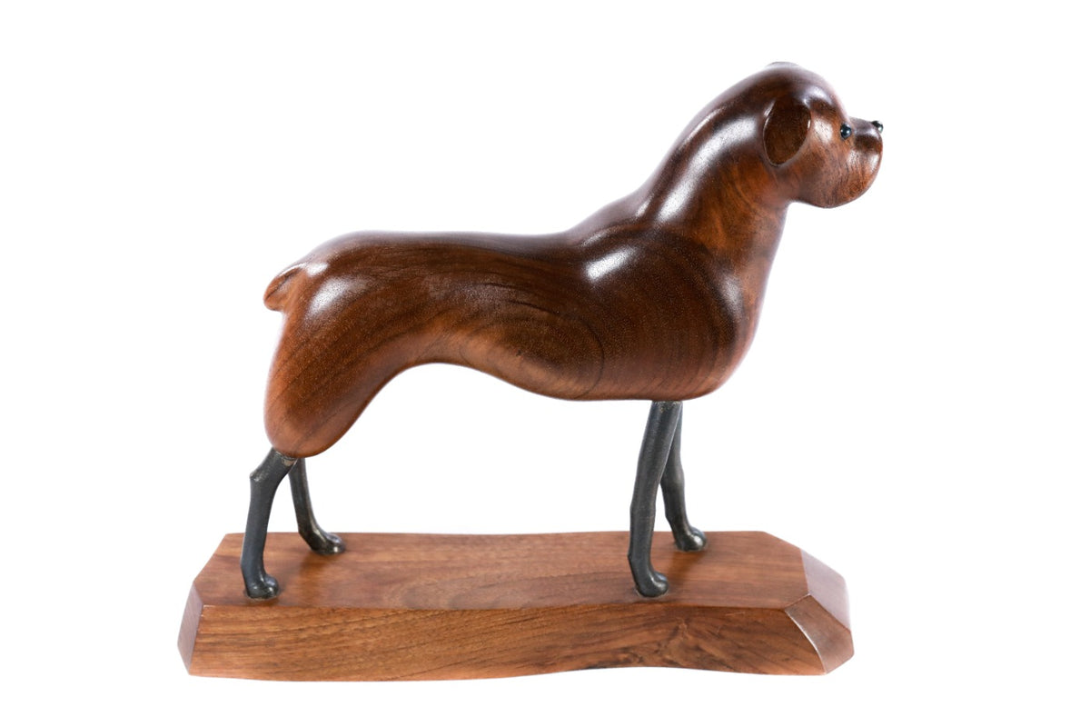 Hand-carved dog sculpture, reverse side view