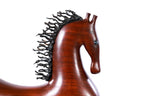 Horse sculpture in carved apricot wood — side view