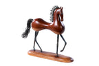 Wooden horse sculpture hand carved with metal pieces — detail view