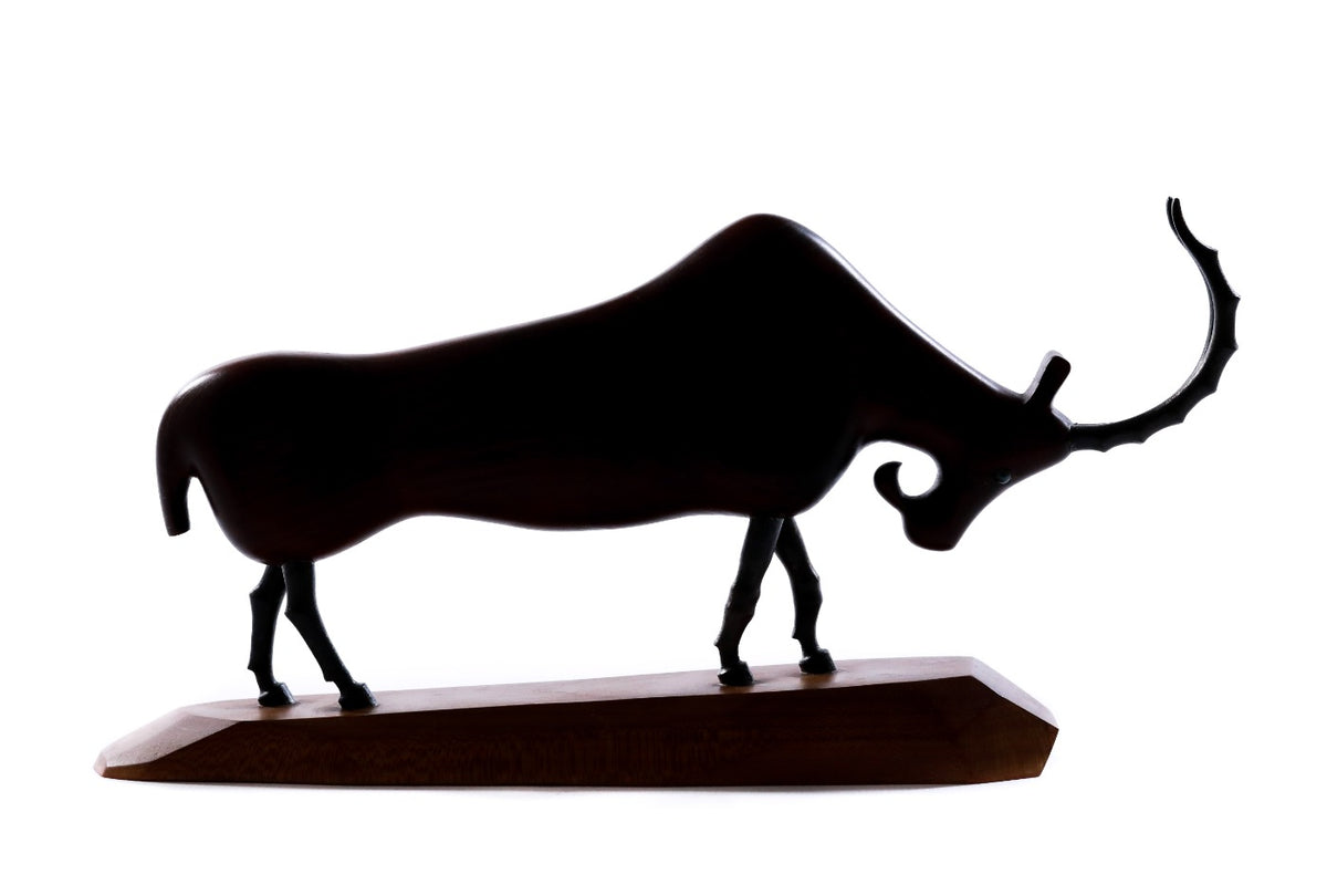 Hand-carved wooden goat sculpture, 11.4" / 29 cm — full view