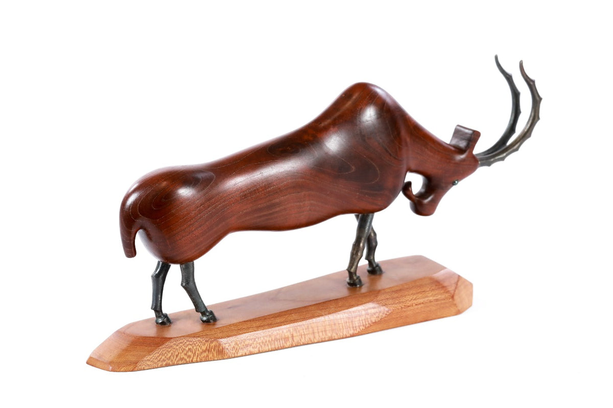 Hand-carved goat sculpture, reverse side view
