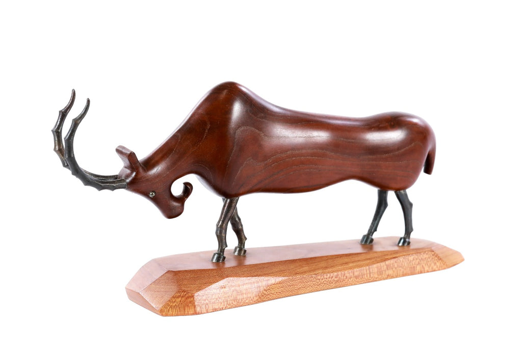 Handmade wooden goat sculpture — carving detail