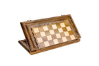 Closed 60 cm wooden chess board standing on edge, showing the carved lattice frame