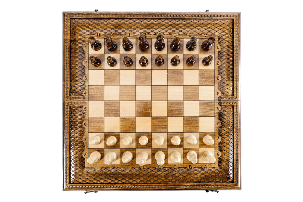 Top-down view of the carved lattice chess set with pieces in starting position
