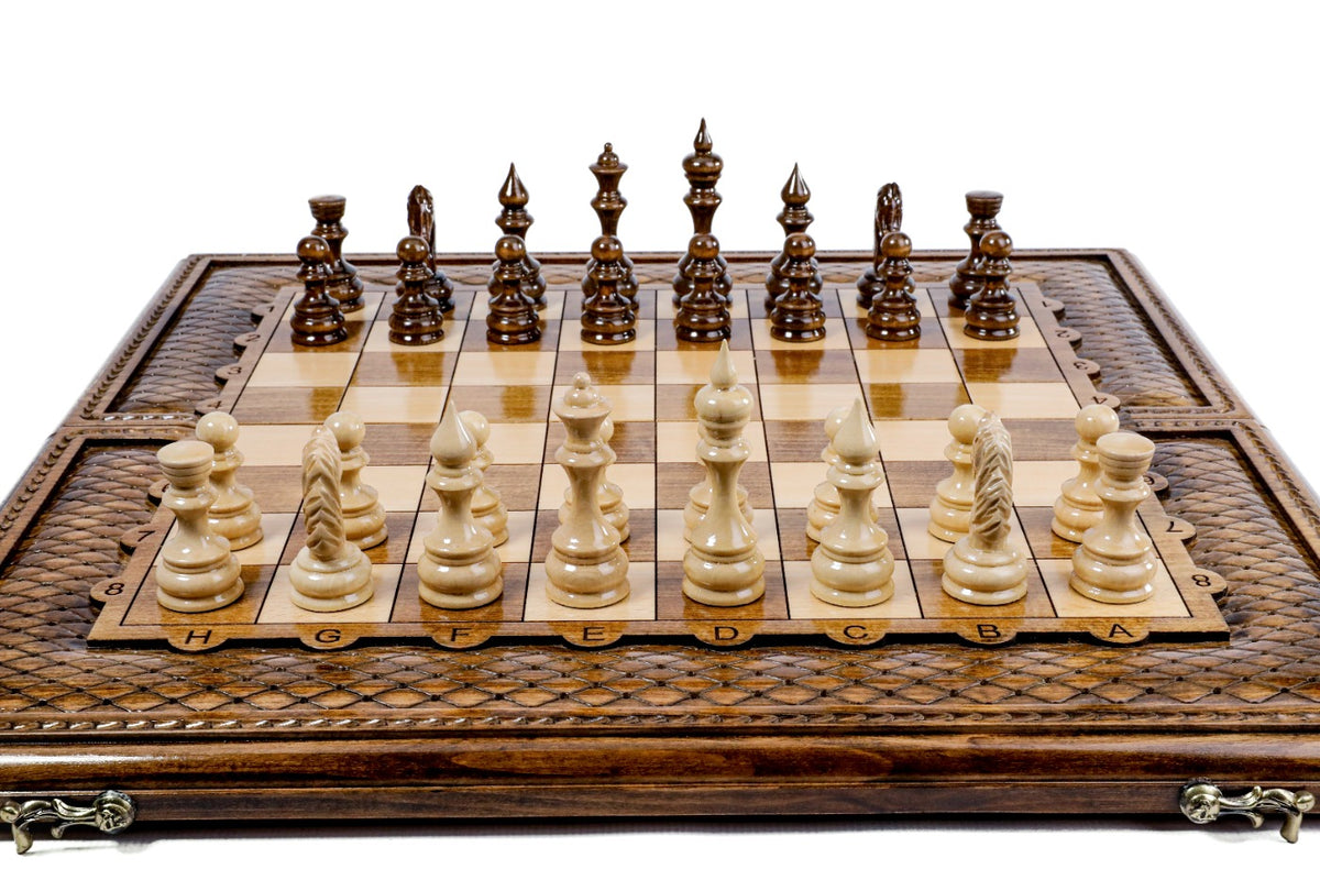 Front view of the luxury chess set with all 32 hand-carved pieces and carved coordinates on the border
