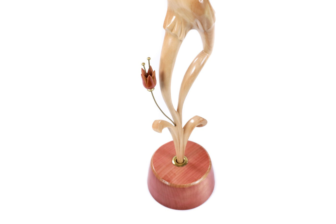 Wooden sculpture of a pregnant woman — close-up