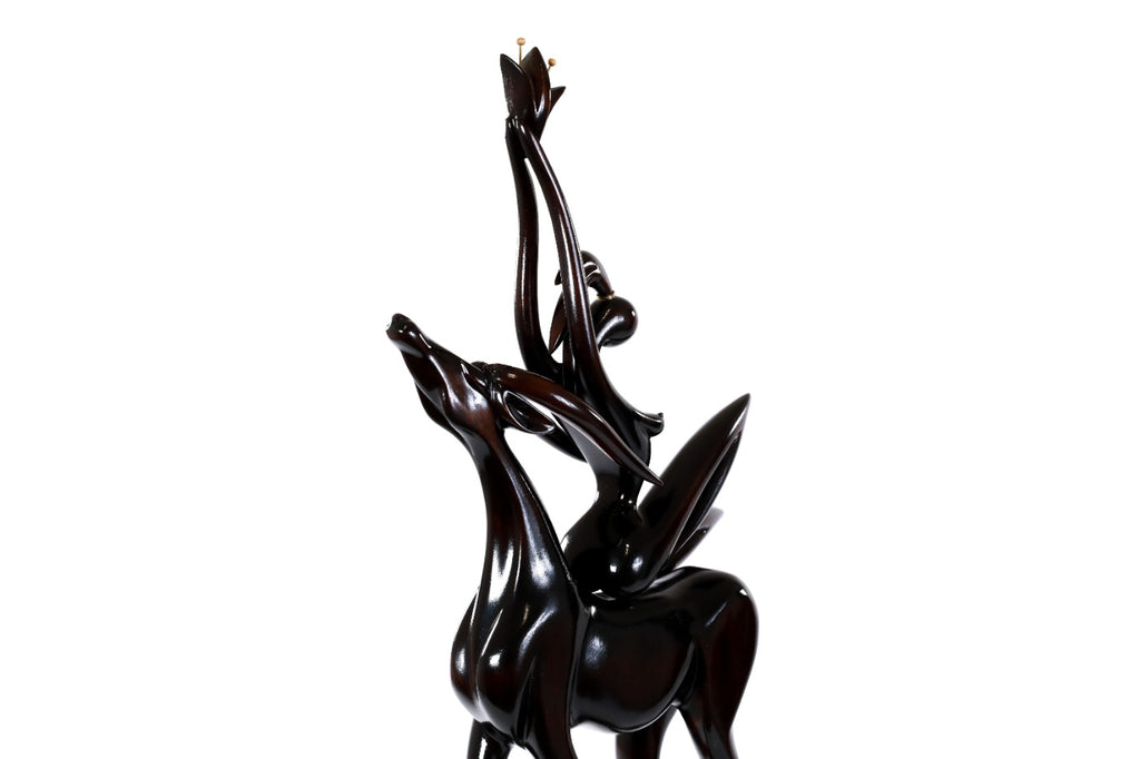 Handmade wooden figurative sculpture of a girl with antelope — carving detail