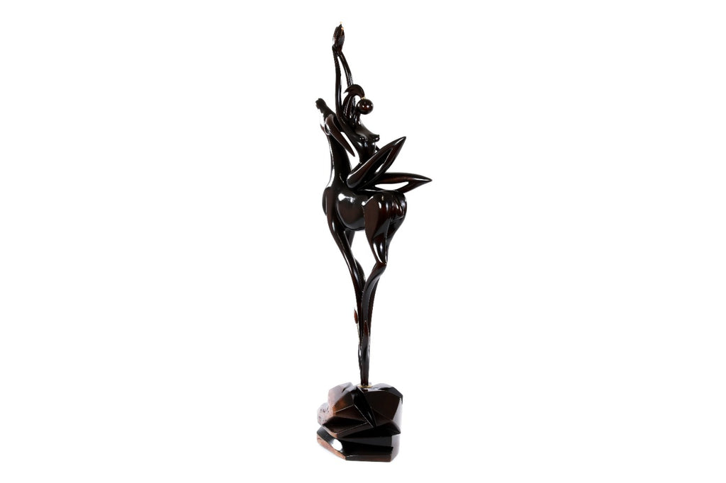 Wooden sculpture of a girl with an antelope — close-up
