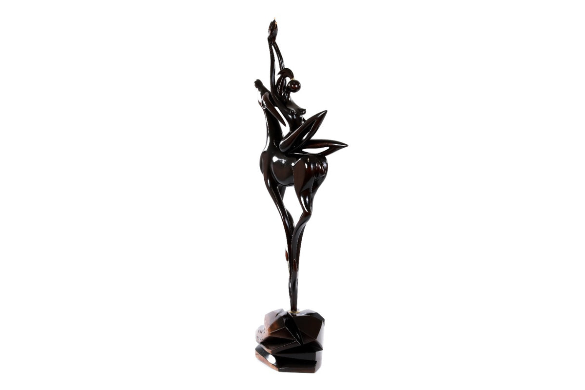 Wooden sculpture of a girl with an antelope — close-up