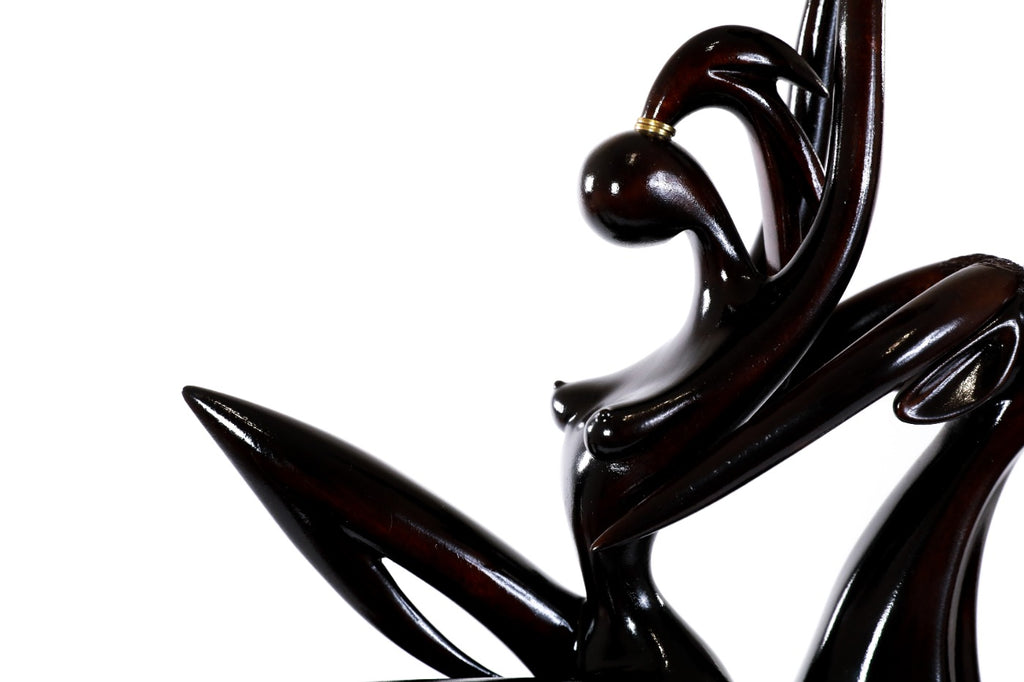 Hand-carved Girl with Antelope sculpture — profile view